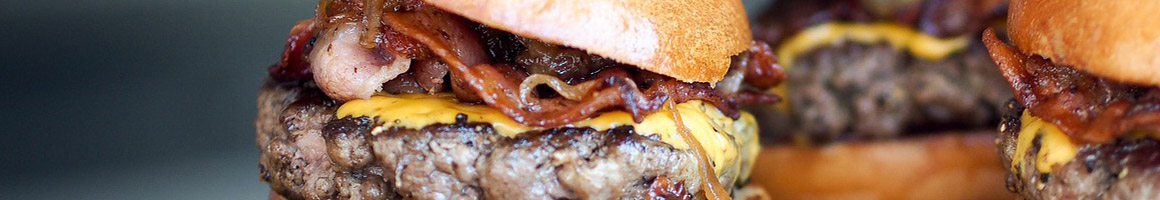 Eating Burger Hot Dog at Cheeseburger Bobby's restaurant in Sandy Springs, GA.